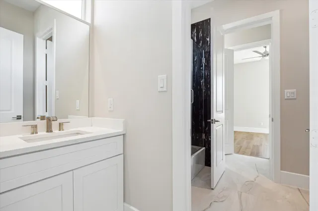 a bathroom with a double vanity sink and mirror