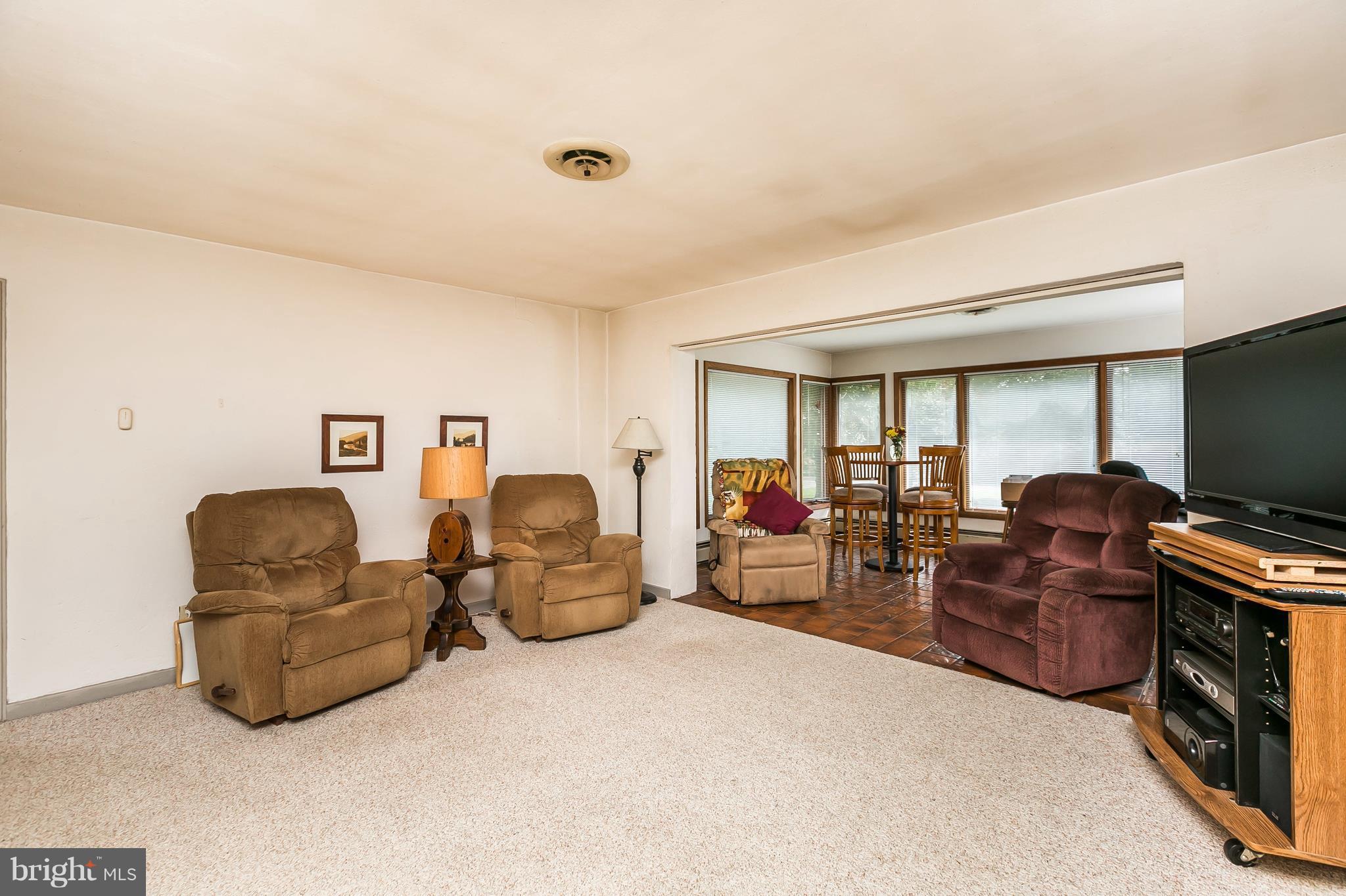 1660 St Margarets Road Annapolis, MD 21409 - Photo 4 of 20 Sunroom with Tiled Floor & Casement Windows