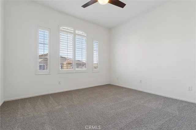 an empty room with a empty space and a window