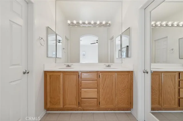 a bathroom with a granite countertop toilet and a shower