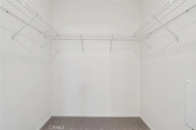 a view of a brick house with a large window