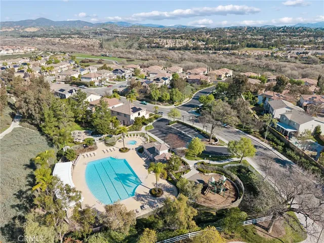 a view of a swimming pool with a yard