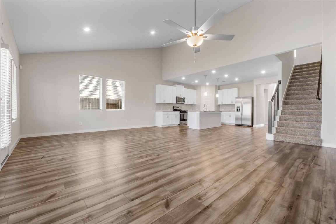 1506 King Rnch Road Conroe, TX 77301 - Photo 11 of 32 an empty room with wooden floor and windows