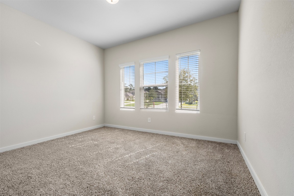 1506 King Rnch Road Conroe, TX 77301 - Photo 18 of 32 an empty room with windows