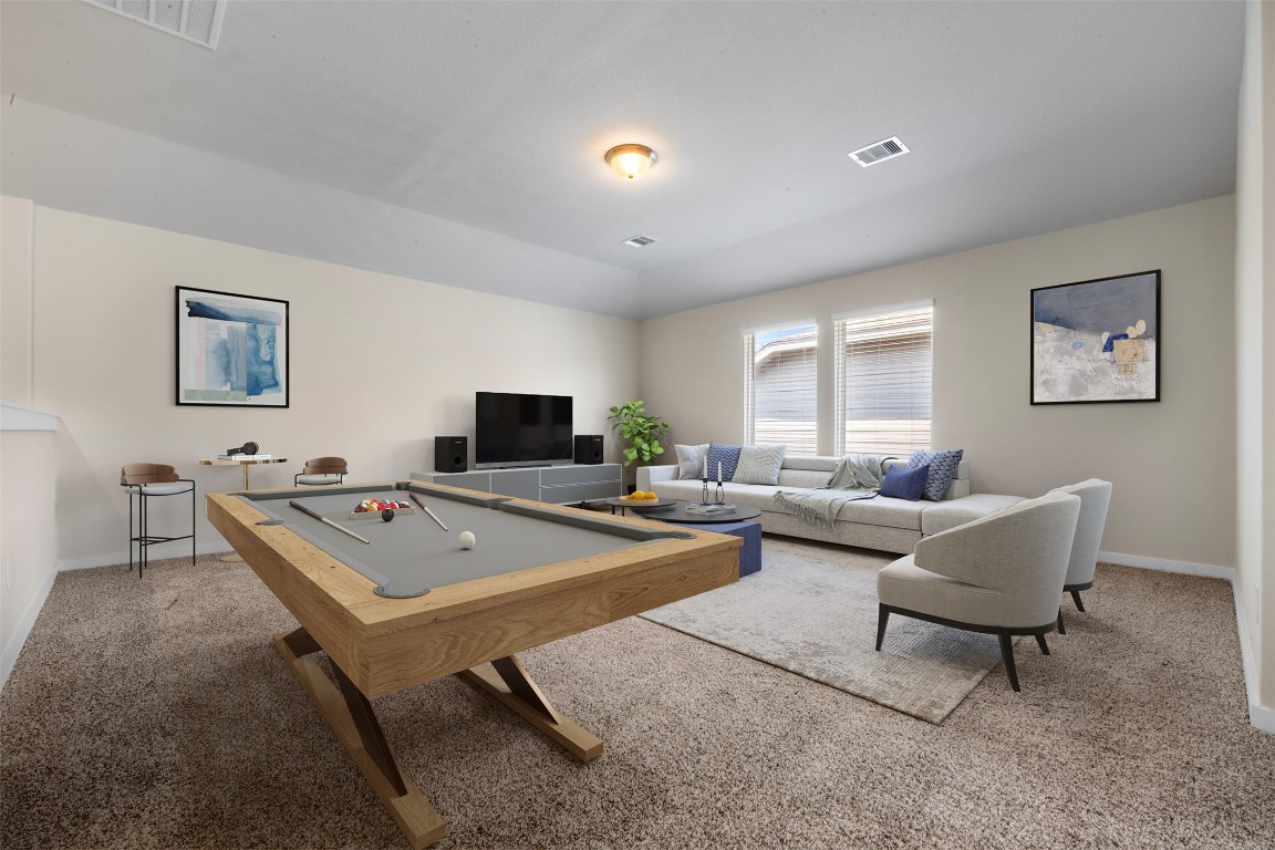 1506 King Rnch Road Conroe, TX 77301 - Photo 22 of 32 a living room with furniture and a flat screen tv