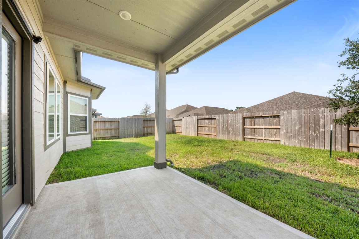1506 King Rnch Road Conroe, TX 77301 - Photo 27 of 32 a view of a house with a yard