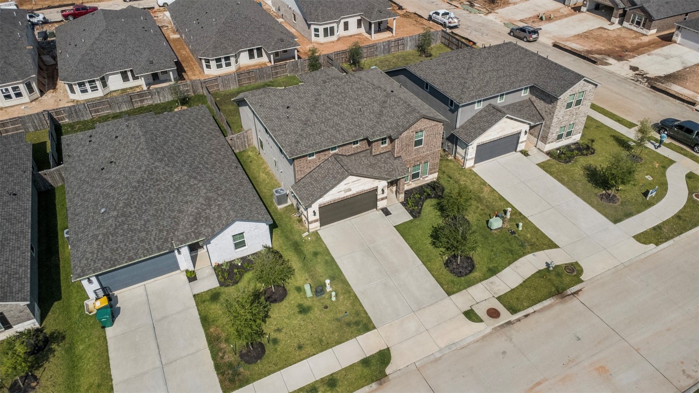 1506 King Rnch Road Conroe, TX 77301 - Photo 31 of 32 an aerial view of a house with a yard