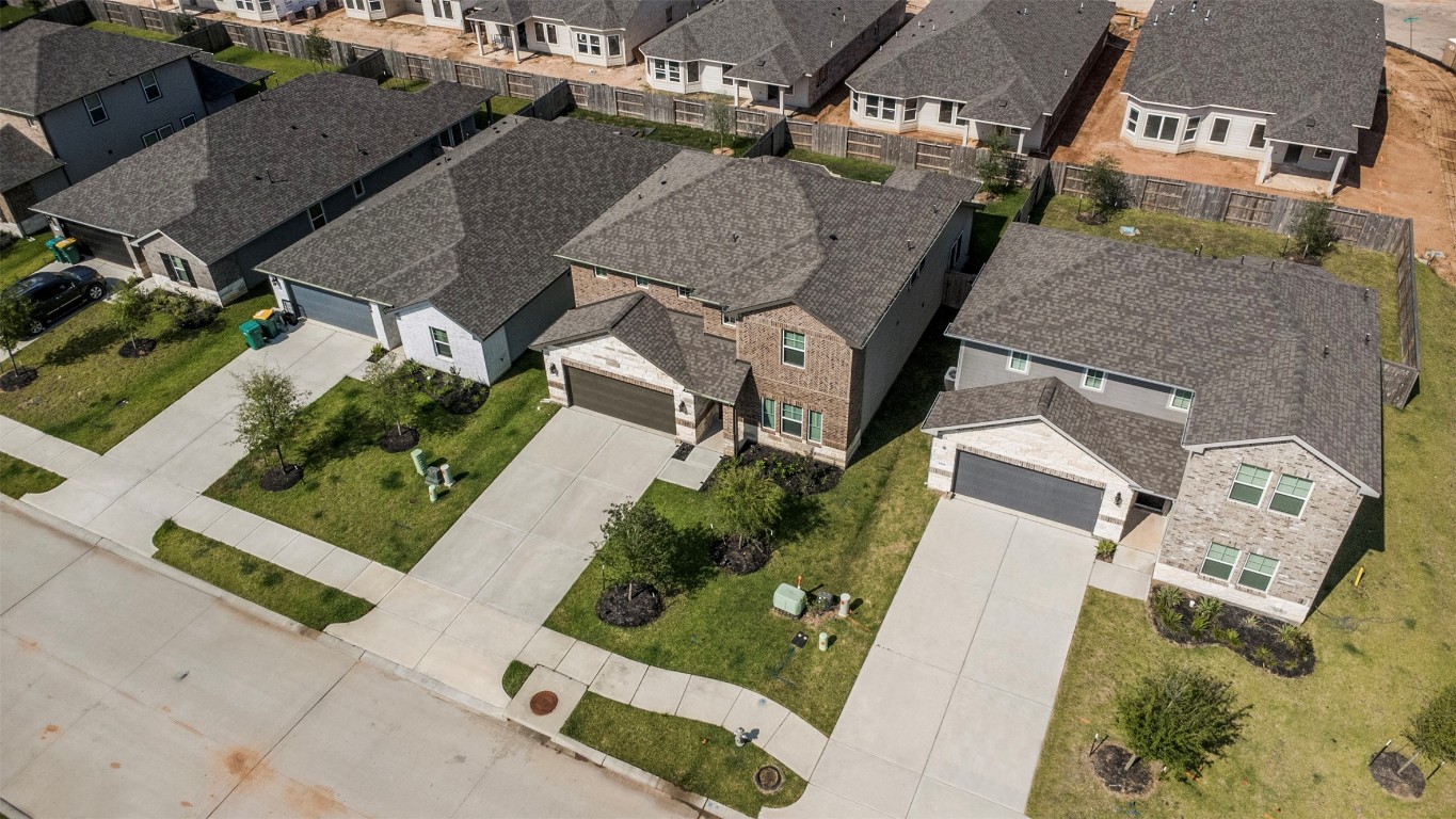 1506 King Rnch Road Conroe, TX 77301 - Photo 32 of 32 an aerial view of a house with a yard