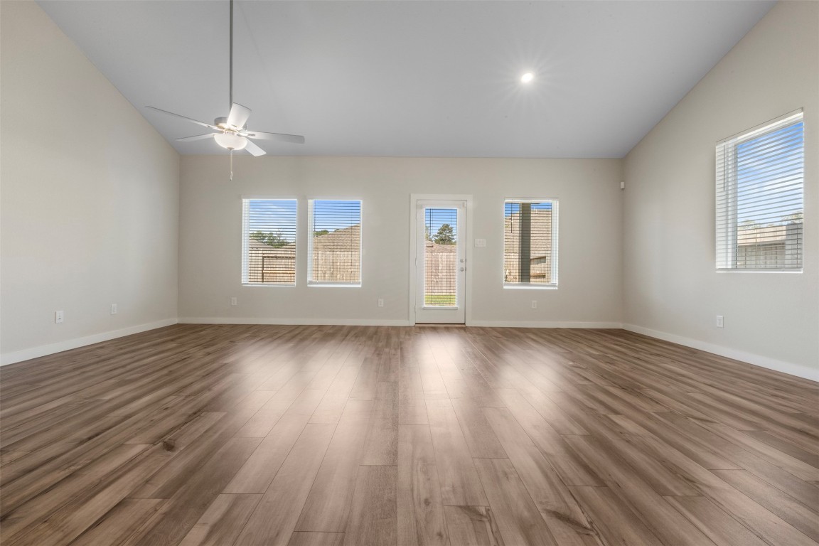 1506 King Rnch Road Conroe, TX 77301 - Photo 8 of 32 wooden floor in an empty room with a window