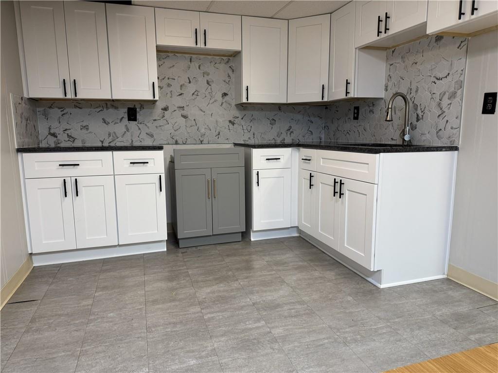 205 Tallow Roswell, GA 30076 - Photo 12 of 19 a kitchen with white cabinets