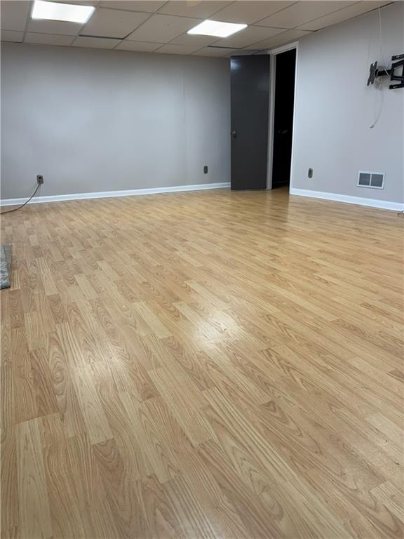 205 Tallow Roswell, GA 30076 - Photo 17 of 19 a view of an empty room with wooden floor
