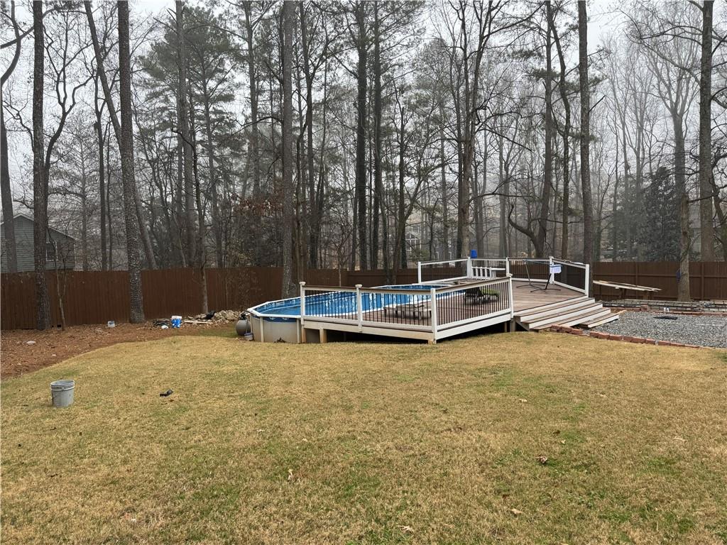 205 Tallow Roswell, GA 30076 - Photo 18 of 19 a view of a swimming pool with a bench