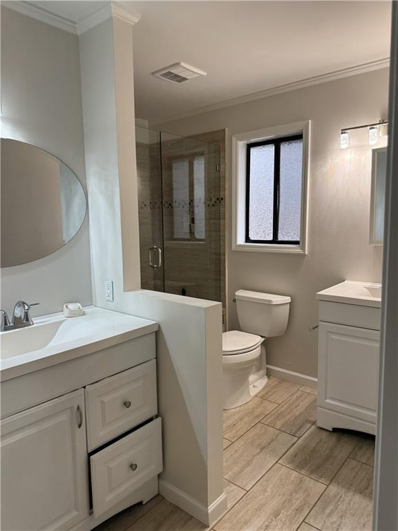 205 Tallow Roswell, GA 30076 - Photo 9 of 19 a bathroom with a toilet a sink and mirror