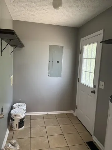 a bathroom with a sink toilet and window