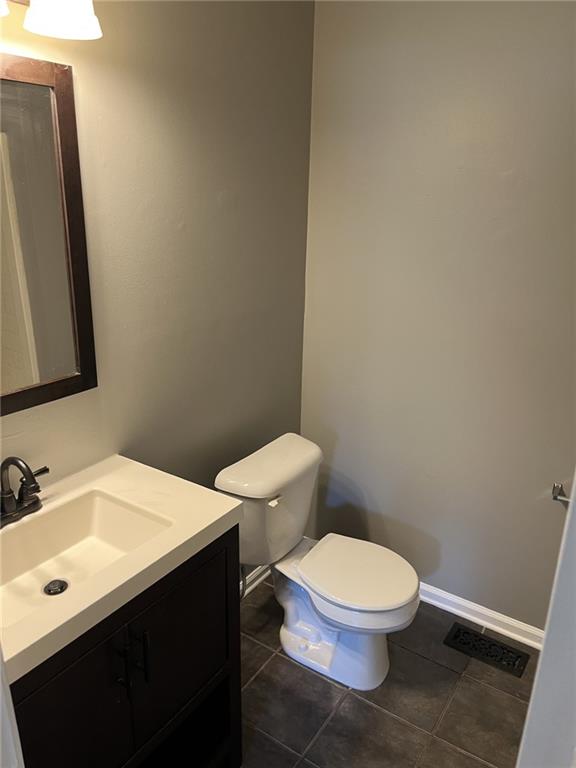 128 Tanner Drive Dallas, GA 30157 - Photo 15 of 23 a white toilet sitting next to a bathroom sink