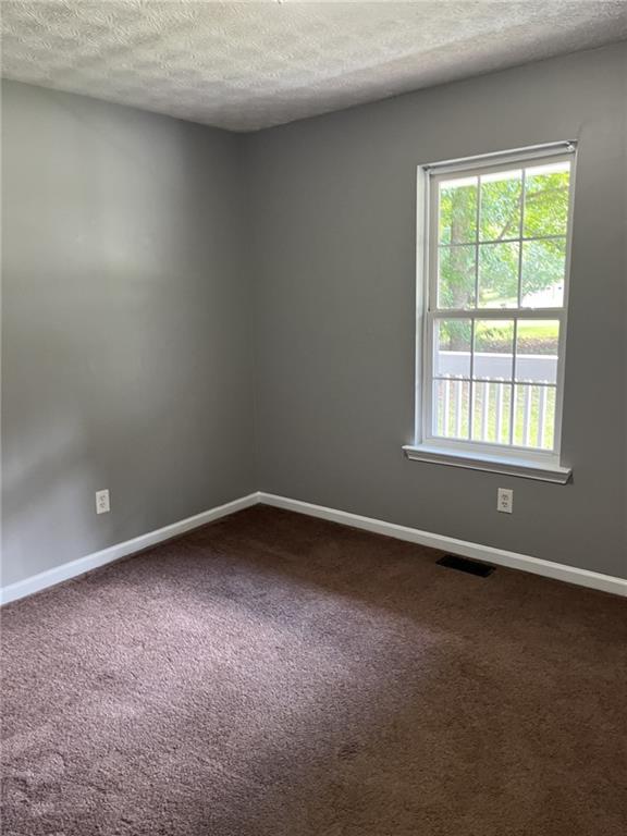 128 Tanner Drive Dallas, GA 30157 - Photo 18 of 23 an empty room with a window