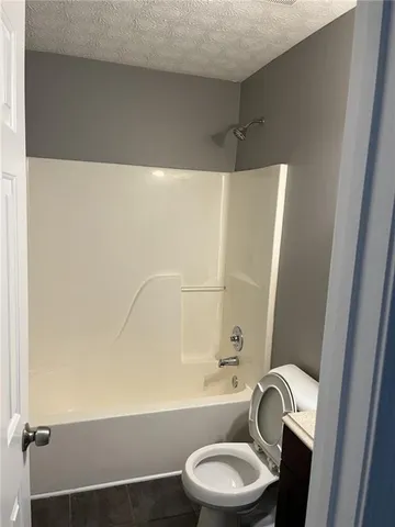 a bathroom with a bathtub and sink