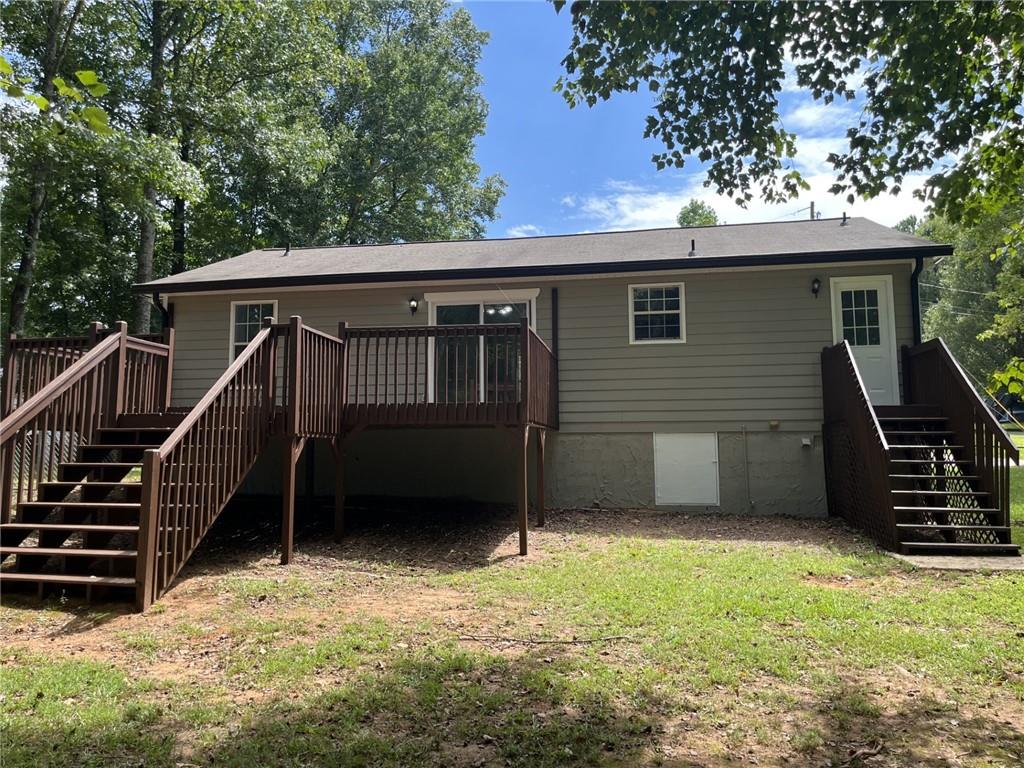 128 Tanner Drive Dallas, GA 30157 - Photo 22 of 23 a view of backyard with deck and stairs