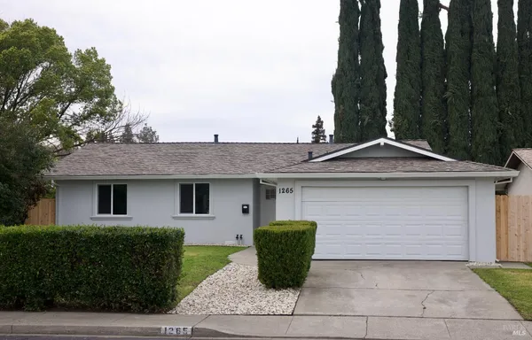 a front view of a house with yard