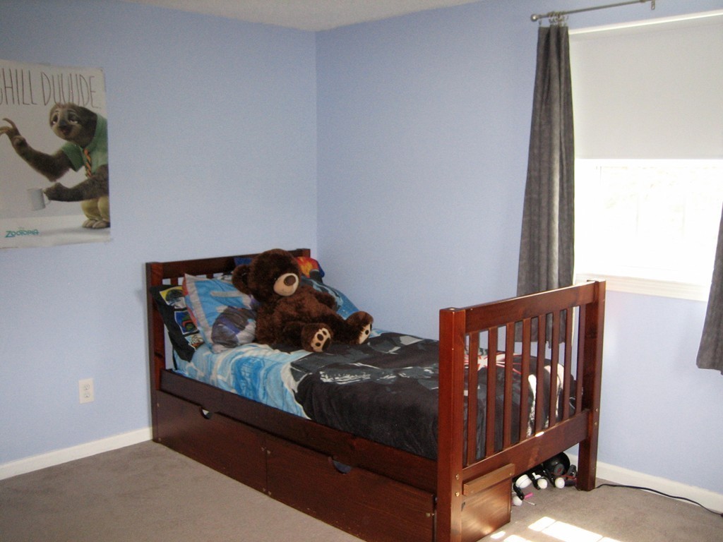 6 Rachel Road Dracut, MA 01826 - Photo 11 of 25 a bed sitting in a bedroom next to a window
