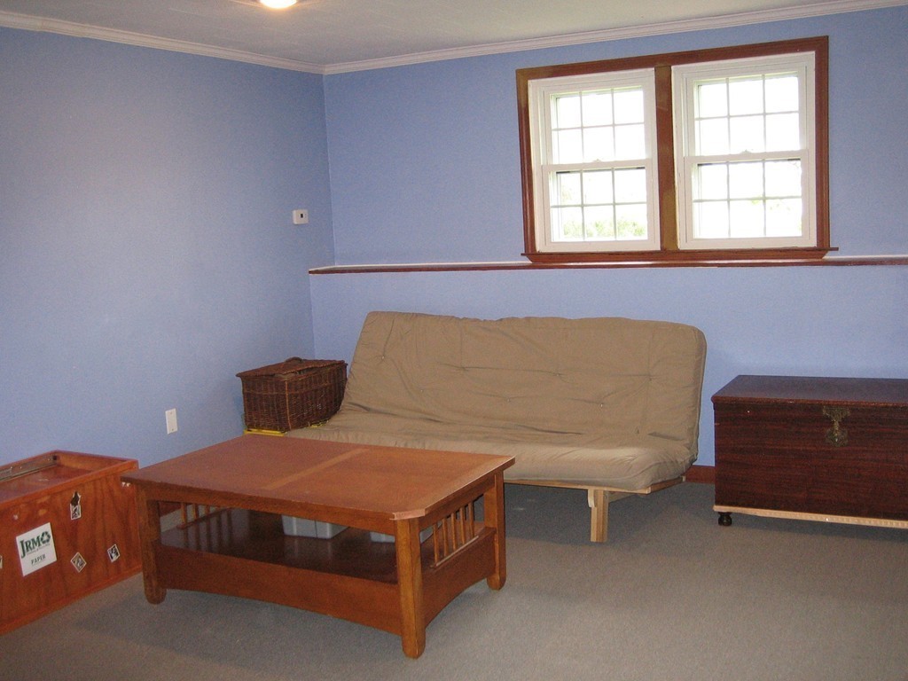 6 Rachel Road Dracut, MA 01826 - Photo 15 of 25 a bedroom with a bed and a lamp with window