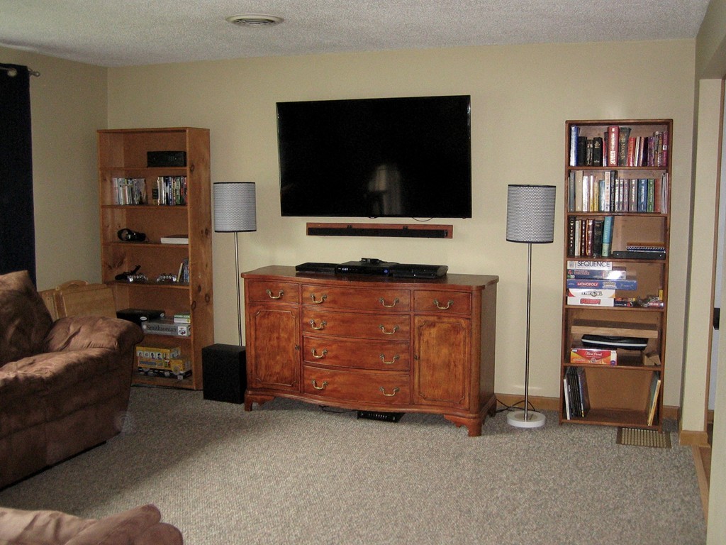 6 Rachel Road Dracut, MA 01826 - Photo 2 of 25 a living room with furniture and a flat screen tv