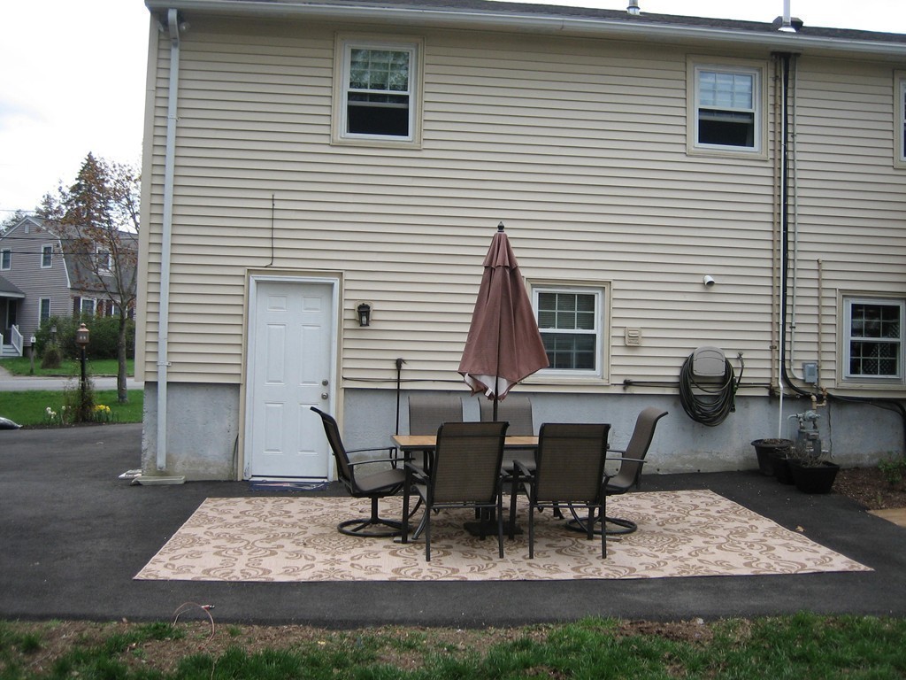 6 Rachel Road Dracut, MA 01826 - Photo 21 of 25 a view of a house with yard and sitting area