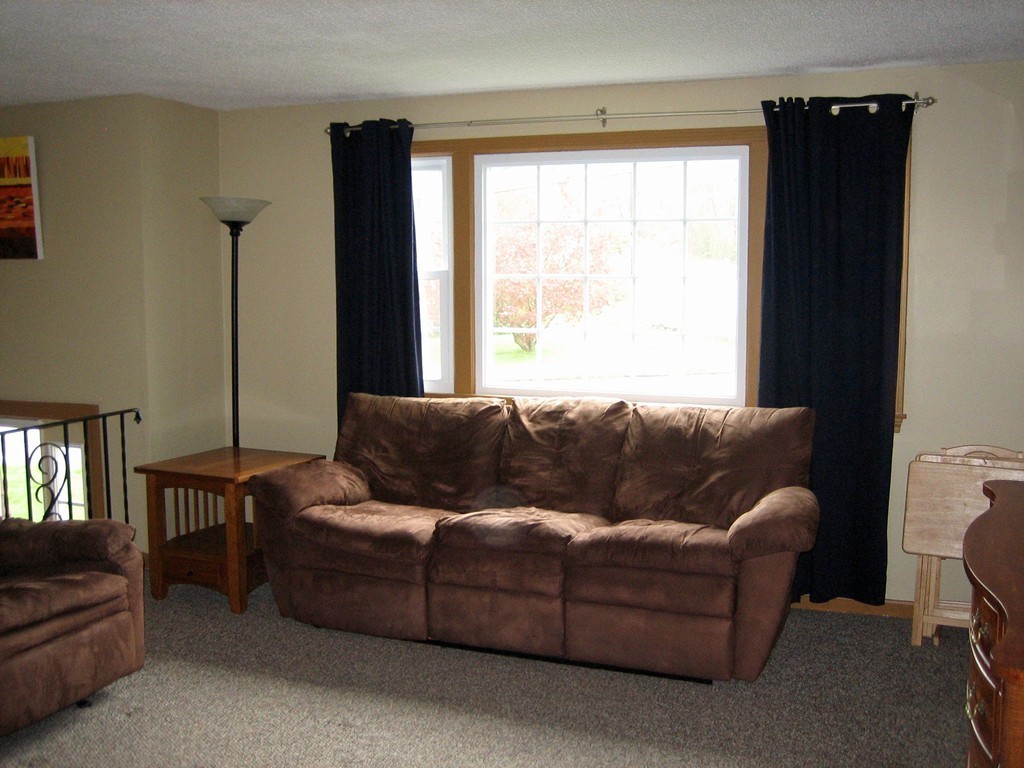 6 Rachel Road Dracut, MA 01826 - Photo 3 of 25 a living room with furniture and a window