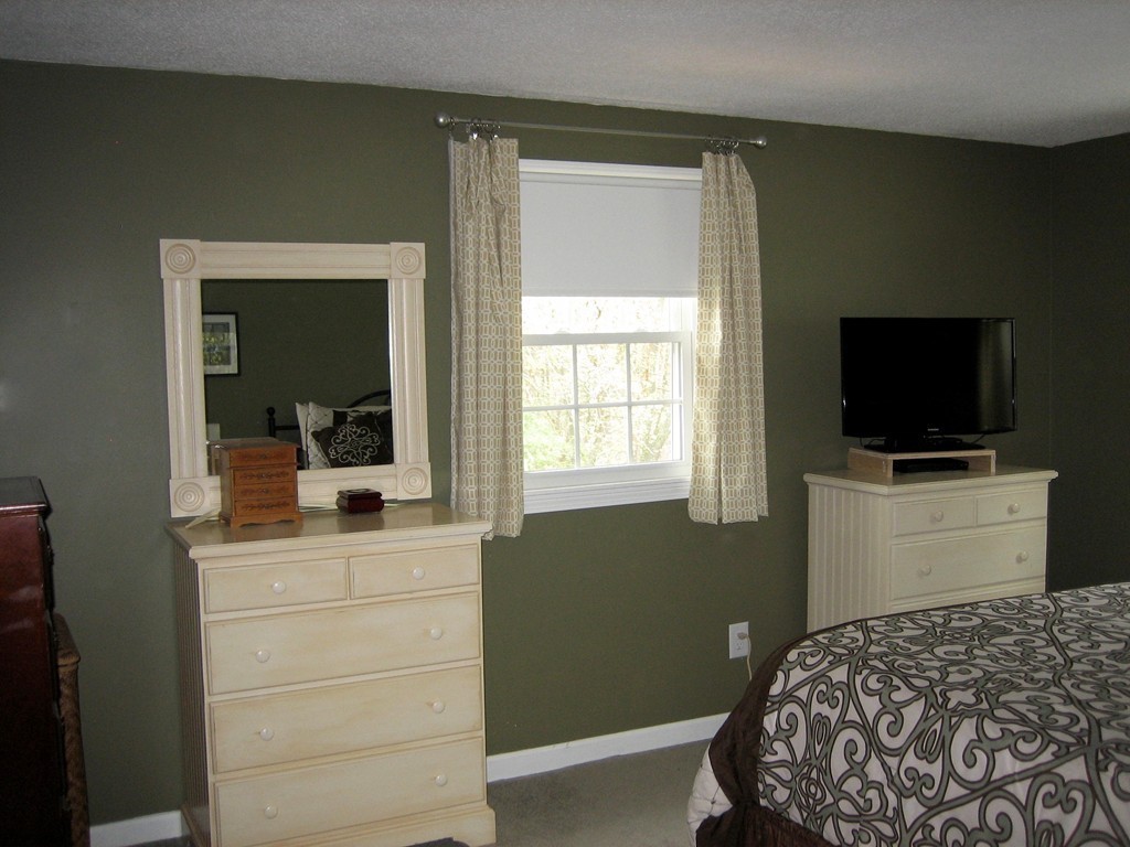 6 Rachel Road Dracut, MA 01826 - Photo 9 of 25 a bedroom with a bed and a flat screen tv