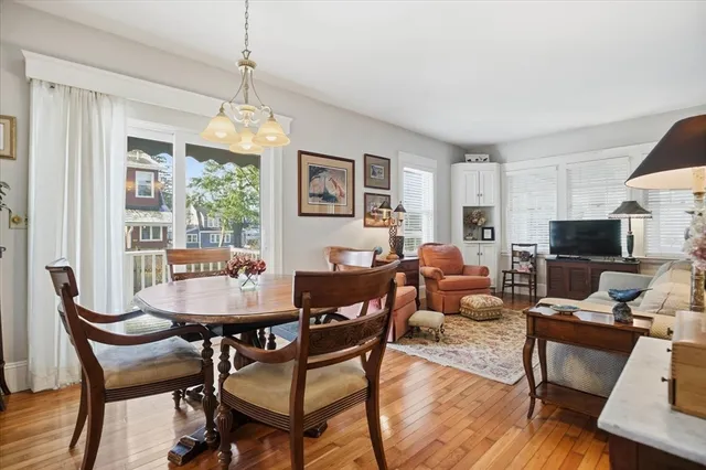 a dining room with stainless steel appliances a stove and a refrigerator