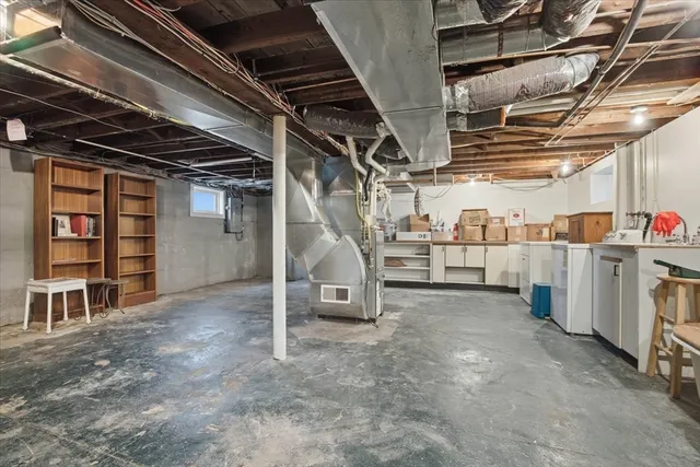a view of empty room with wooden walls