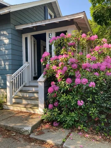 a view of a house with a flower garden