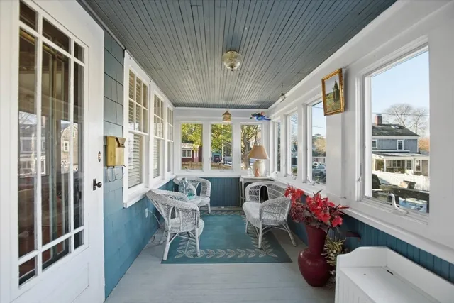a dining room with furniture and window