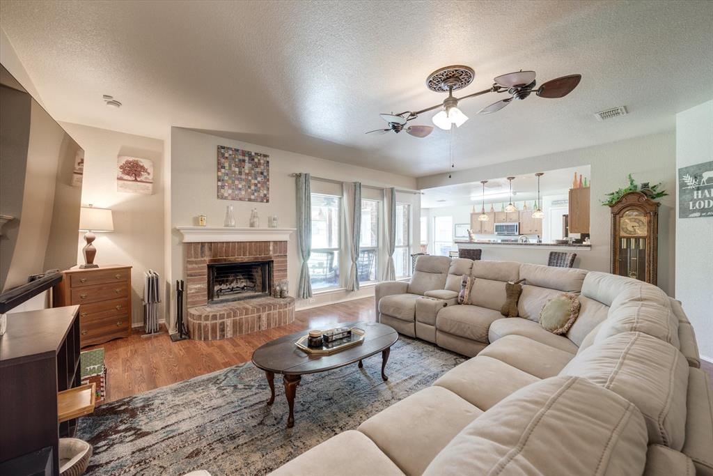 544 Harbor Crest Road Azle, TX 76020 - Photo 1 of 1 a living room with furniture fireplace and window
