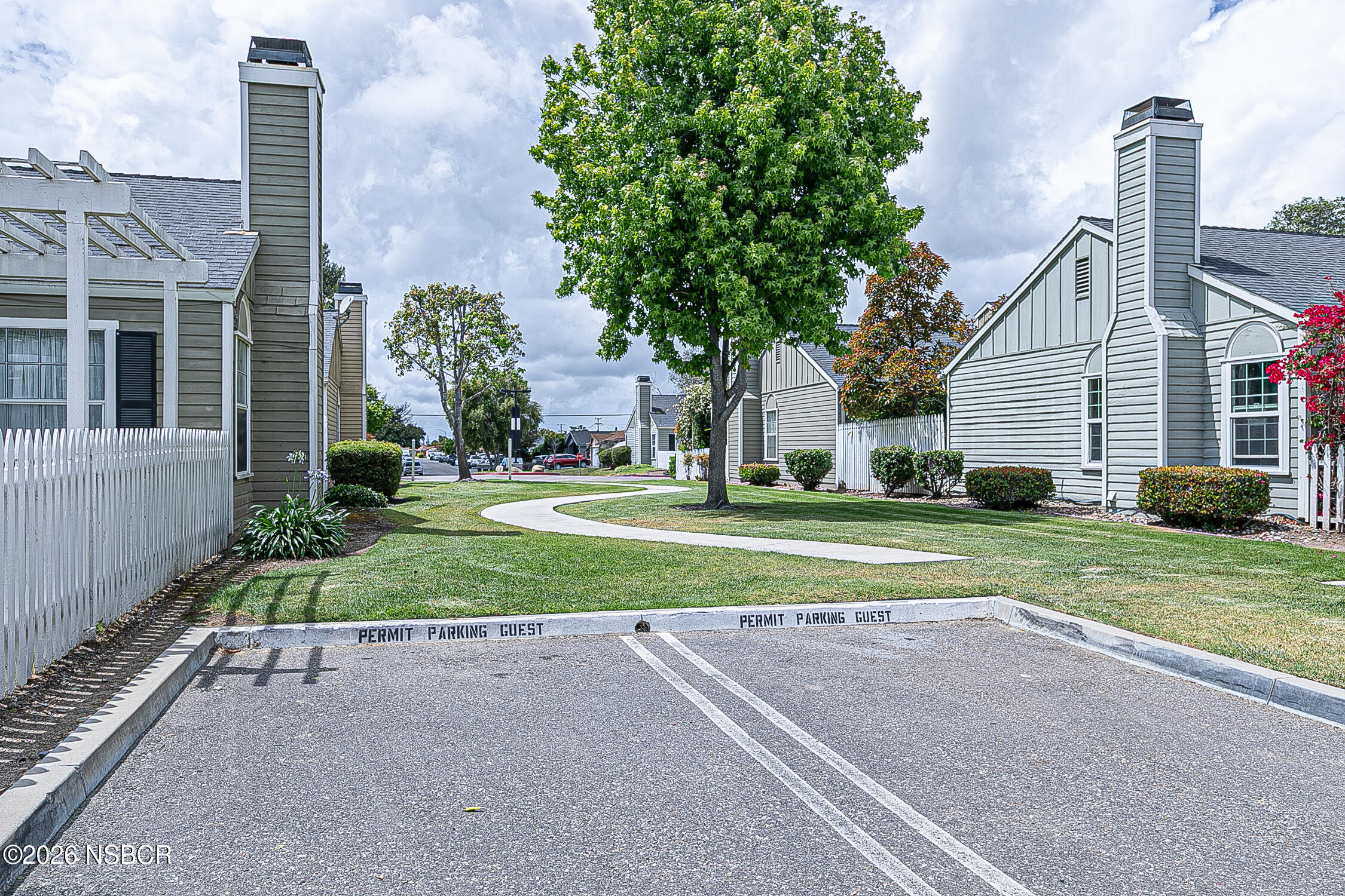 712 Pebble Beach Place Santa Maria, CA 93454 - Photo 30 of 31 a view of a house with a yard and large tree