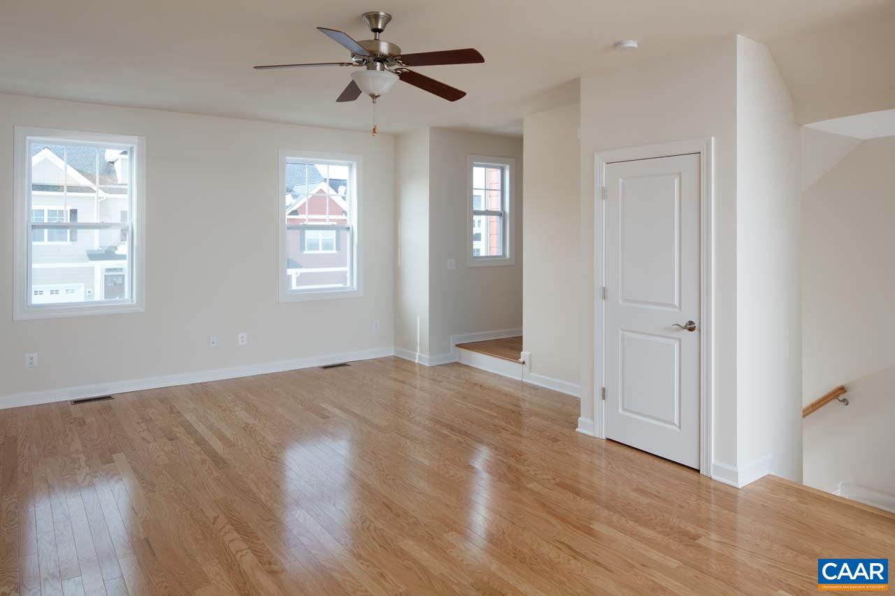 439 Rolkin Road Charlottesville, VA 22911 - Photo 3 of 26 a view of an empty room with wooden floor and a window