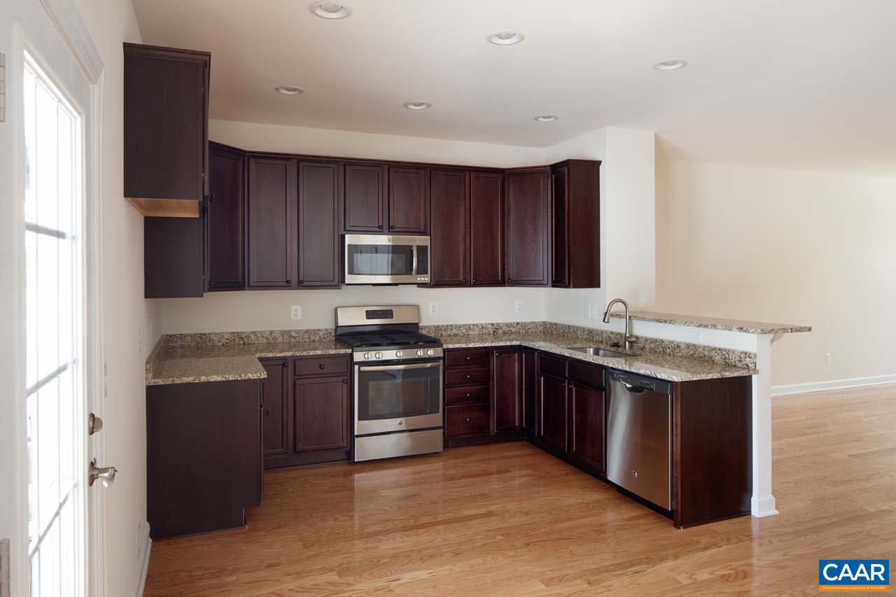 439 Rolkin Road Charlottesville, VA 22911 - Photo 6 of 26 a kitchen with stainless steel appliances granite countertop a stove a sink dishwasher a refrigerator and a microwave oven