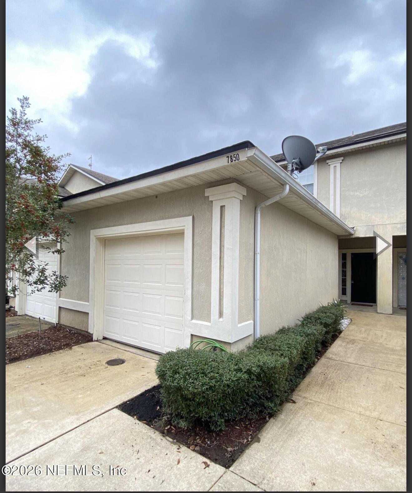 7850 Melvin Road Jacksonville, FL 32210 - Photo 2 of 12 a front view of a house with a yard