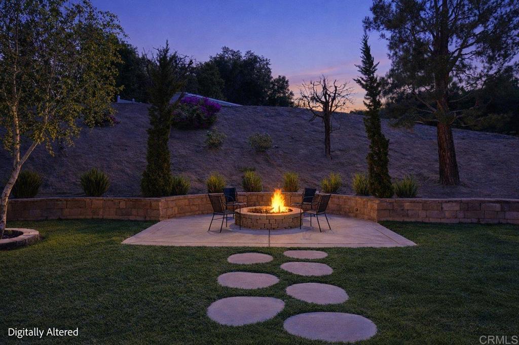 30405 Del Rey Road Temecula, CA 92591 - Photo 19 of 46 a view of a backyard with plants and a patio