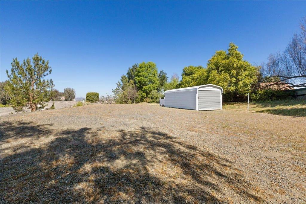 30405 Del Rey Road Temecula, CA 92591 - Photo 33 of 46 a view of a field with some trees in the background