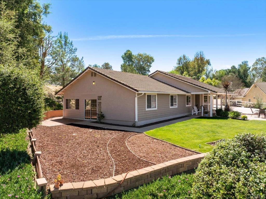 30405 Del Rey Road Temecula, CA 92591 - Photo 35 of 46 a front view of a house with garden