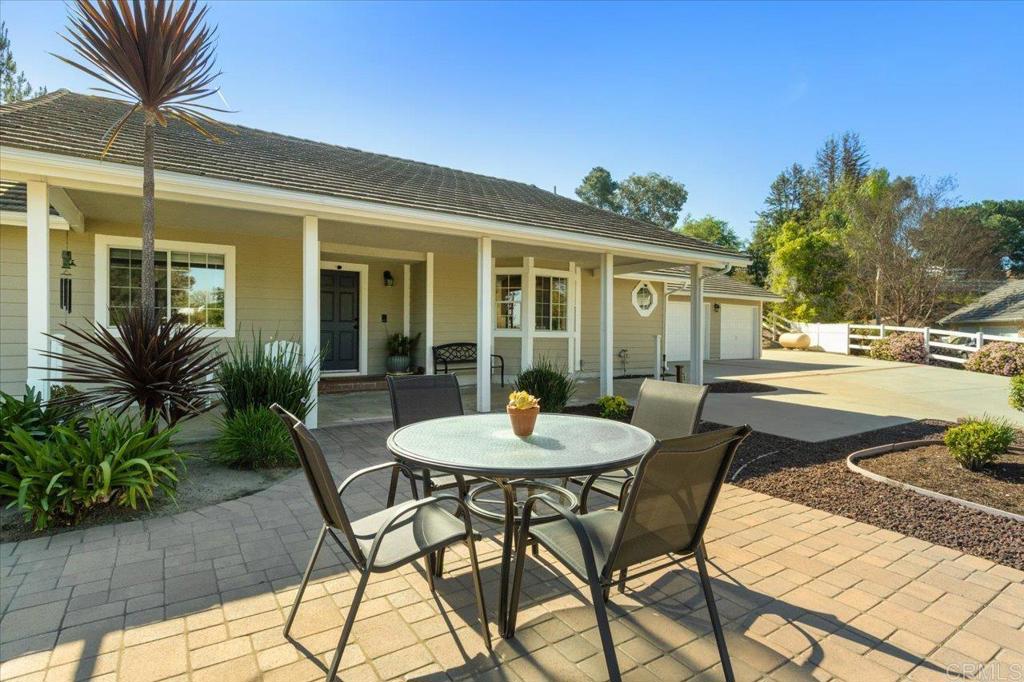 30405 Del Rey Road Temecula, CA 92591 - Photo 36 of 46 a patio with a table and chairs and potted plants