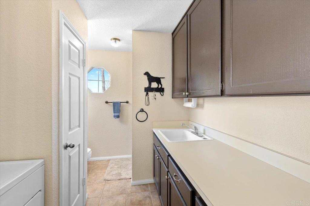 30405 Del Rey Road Temecula, CA 92591 - Photo 41 of 46 a bathroom with a sink and a mirror