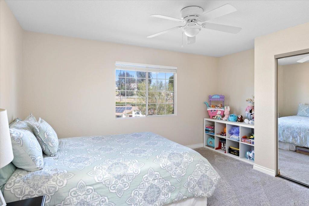 30405 Del Rey Road Temecula, CA 92591 - Photo 44 of 46 a bedroom with a bed and a window