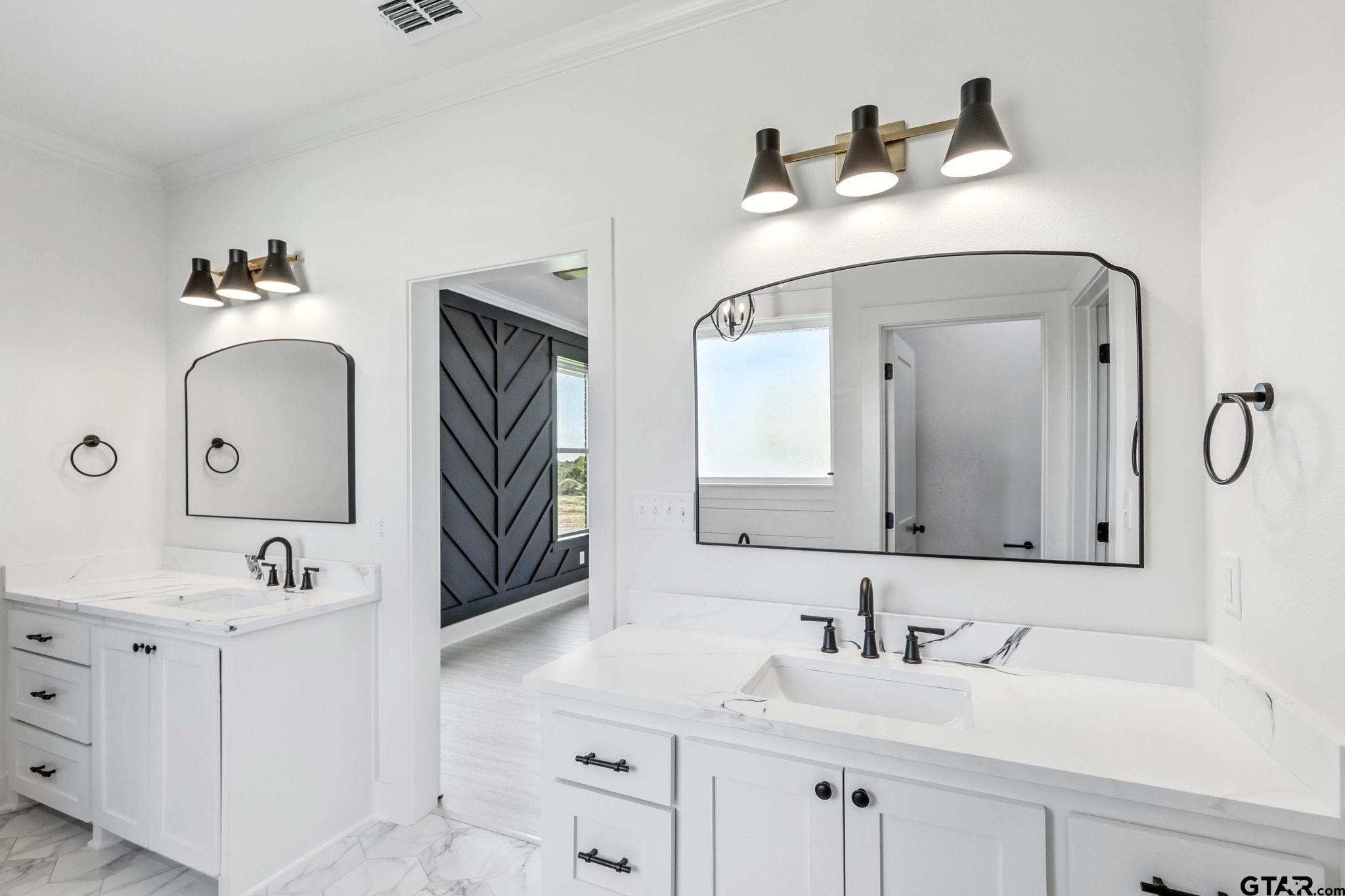 15524 County Road 434 Lindale, TX 75771 - Photo 13 of 23 a bathroom with double vanity sinks and a mirror