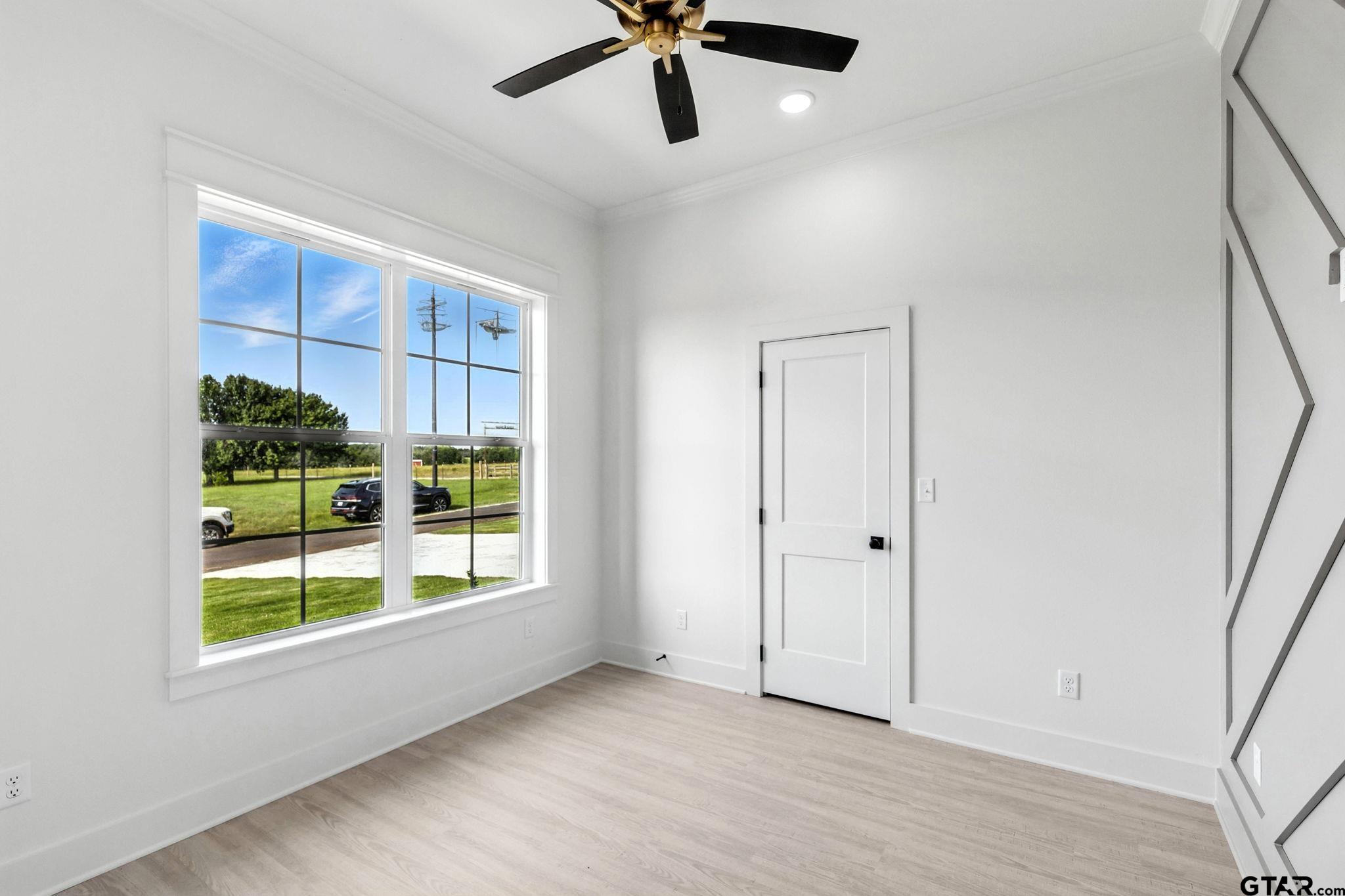 15524 County Road 434 Lindale, TX 75771 - Photo 19 of 23 a view of an empty room with a window and wooden floor