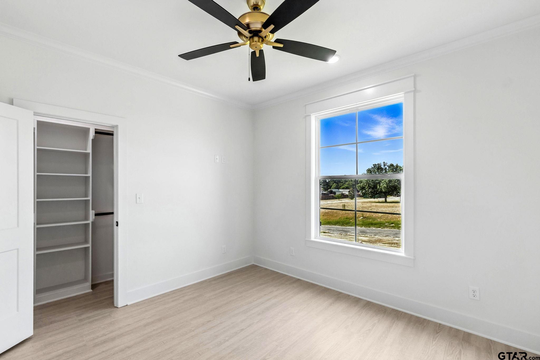 15524 County Road 434 Lindale, TX 75771 - Photo 20 of 23 a view of an empty room with a window and a ceiling fan