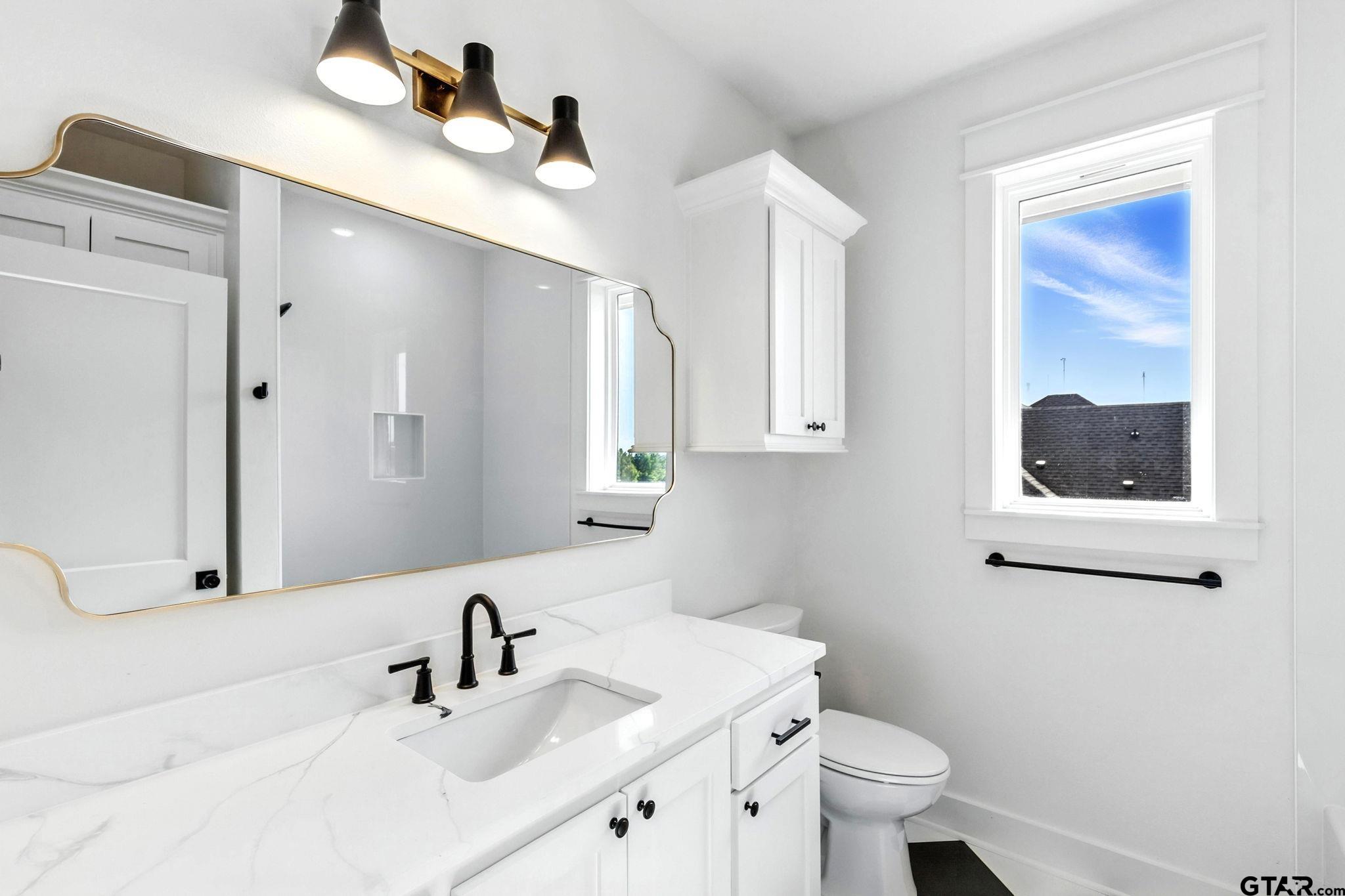 15524 County Road 434 Lindale, TX 75771 - Photo 21 of 23 a bathroom with a sink and a mirror