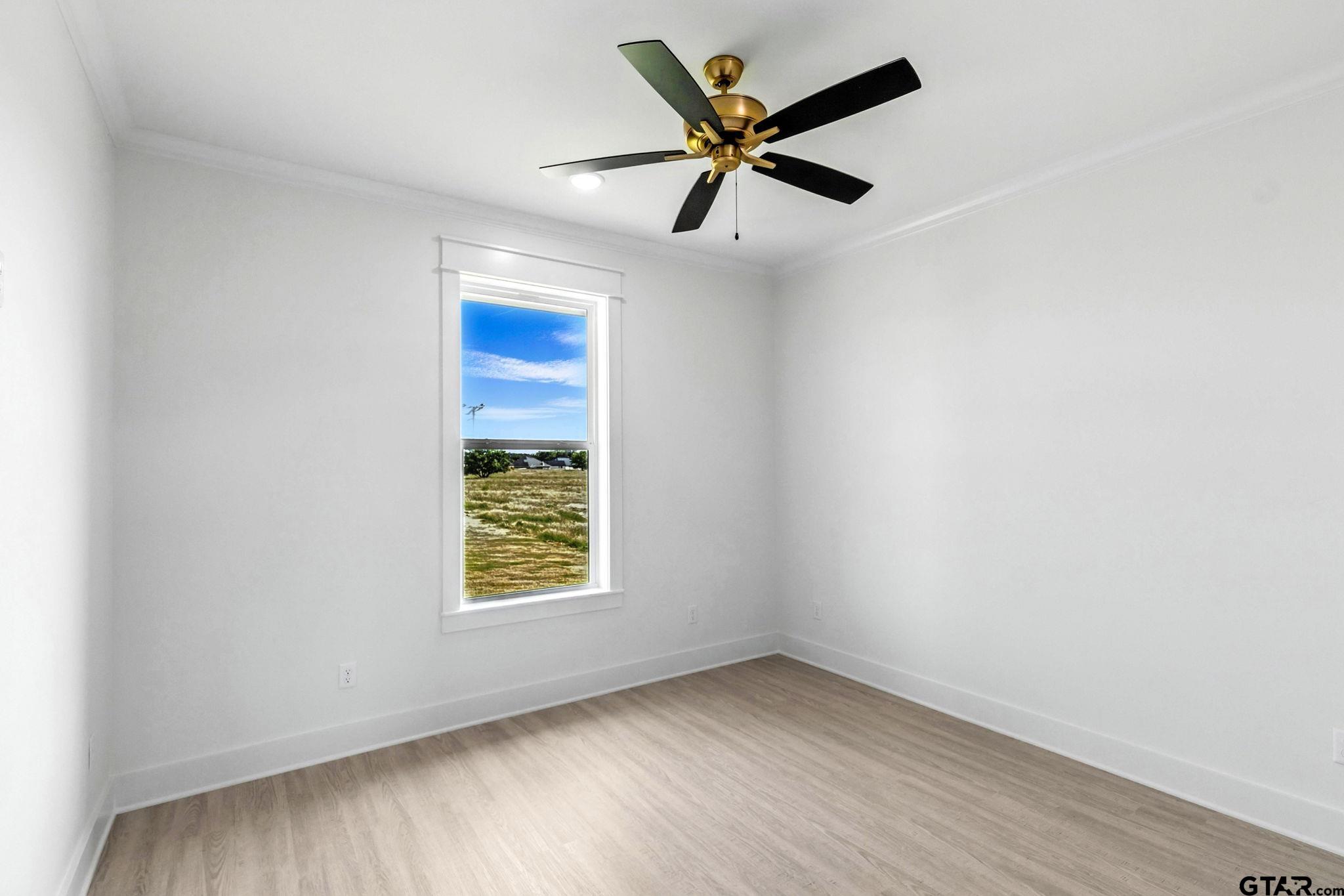 15524 County Road 434 Lindale, TX 75771 - Photo 22 of 23 an empty room with a window and a fan