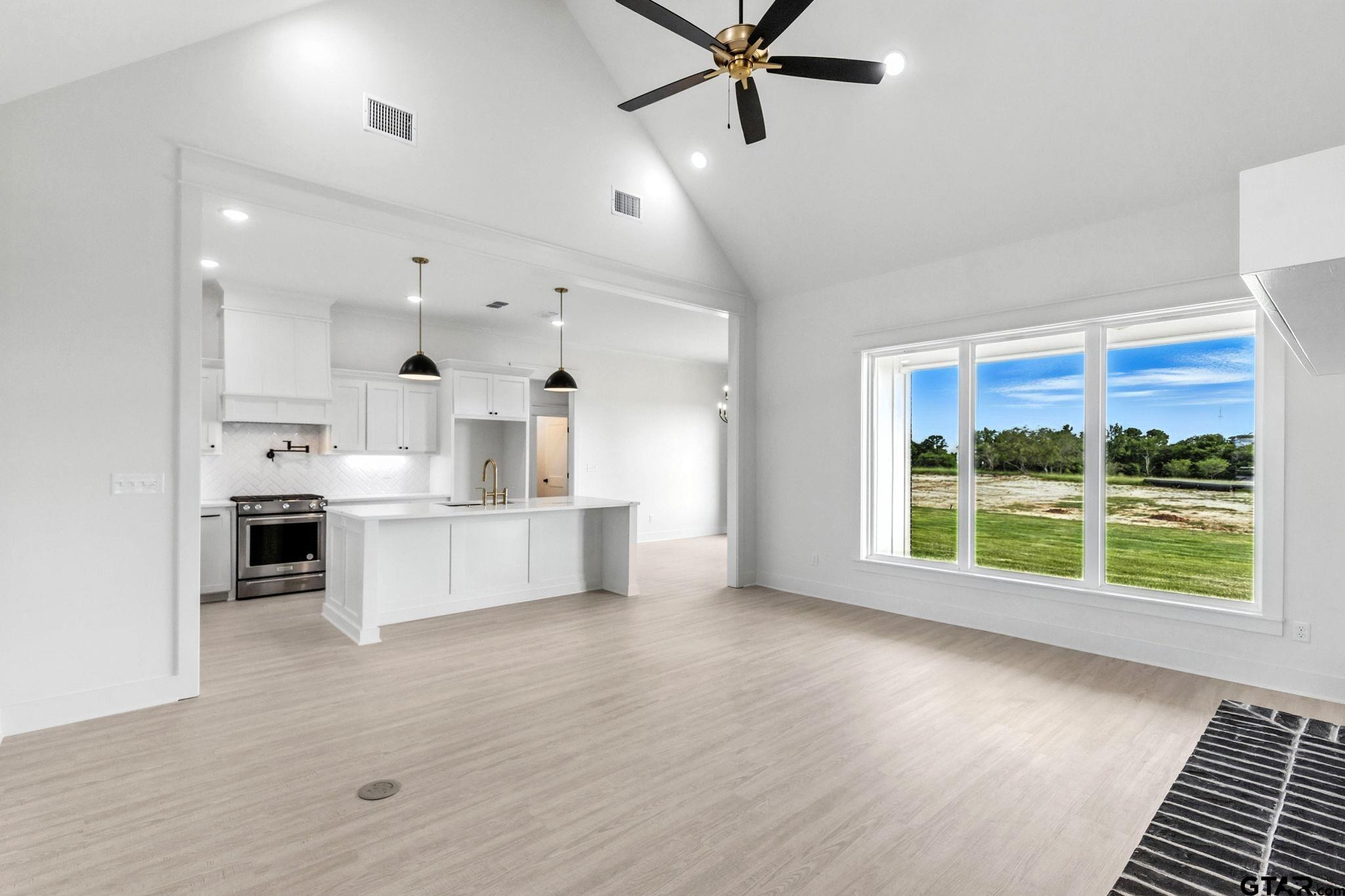 15524 County Road 434 Lindale, TX 75771 - Photo 9 of 23 a large white kitchen with a large window appliances and cabinets